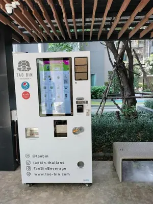 a vending machine with a display of a cell phone at Ceil by Sansiri BTS Ekamai Shuttle to BTS Ekamai , Gateway mall , Major Cineplex mid city. Great place to explore bangkok in Bangkok