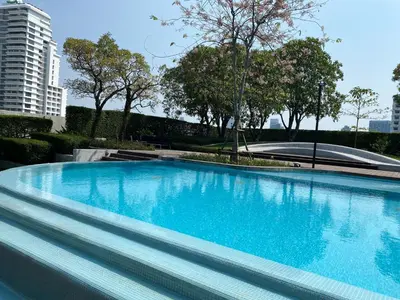 a large blue swimming pool in a city at Ceil by Sansiri BTS Ekamai Shuttle to BTS Ekamai , Gateway mall , Major Cineplex mid city. Great place to explore bangkok in Bangkok