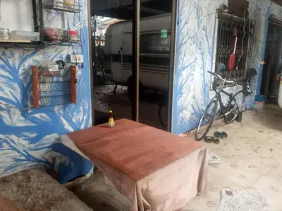 a wooden table in a room with a wall at NP Prime FREE WiFi in Bangkok