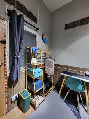 a room with a bunk bed and a table at 113 Cozy Loft style with cool fan with free Wi-fi in Bangkok