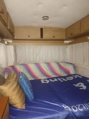 a bed in the back of a trailer at Caravan & Smart in Bangkok