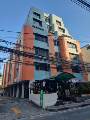 a tall building with a store in front of it at 12PM Bangkok in Bang Kapi