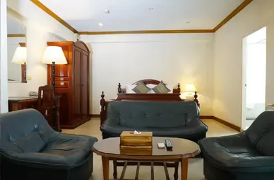 a living room with two couches and a table at 12PM Bangkok in Bang Kapi