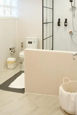 a white bathroom with a tub and a toilet at 2BR Stylist Rare Find China Town in Bangkok