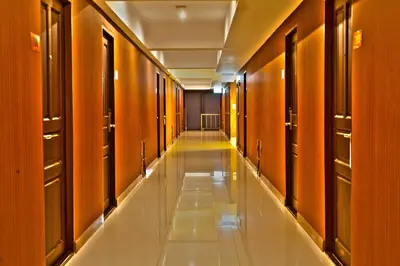 a long corridor with wooden walls and a long hallway at Chateau de Sukhumvit in Bangkok
