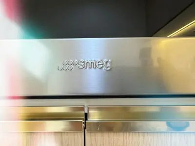 a close up of a metal counter top with the osn synergy logo at PRIME SUKHUMVIT MODERN HOME, Phrom Phong BTS, Em District, Up to 14 guests in Bangkok