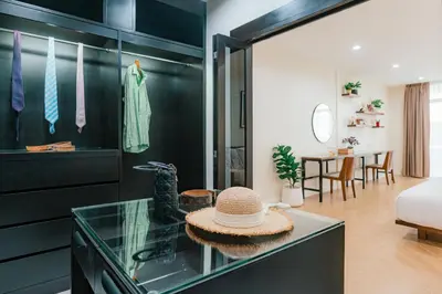 a room with a glass counter with a hat on it at PRIME SUKHUMVIT MODERN HOME, Phrom Phong BTS, Em District, Up to 14 guests in Bangkok