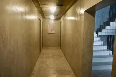 a hallway with a staircase in a building at Hash Apartment with unique chill design at Silom Soi 3 in Bangkok