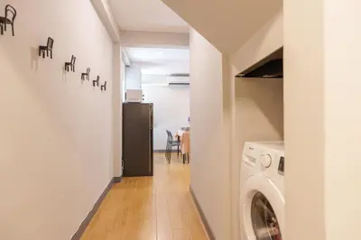 a hallway with a washer and dryer in a house at t-t-haus in Bangkok