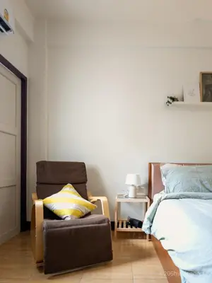 a bedroom with a bed and a chair next to a bed at 206HiddenNest, Local Room with Street Food only 15 min walk to Skytrain in Bangkok