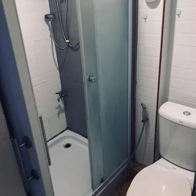 a bathroom with a shower and a toilet at Chubby 5 in Bang O