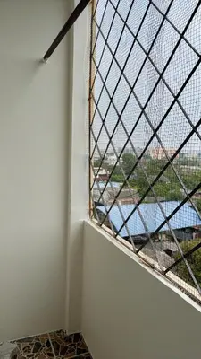 a window in a room with a view of a river at Suppamas Mansion ศุภมาส แมนชั่น in Bangkok Yai