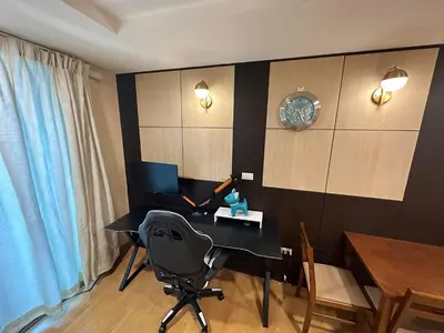 a room with a desk with a computer on it at 2bd Apartment near icon Siam close to Everything in Bangkok