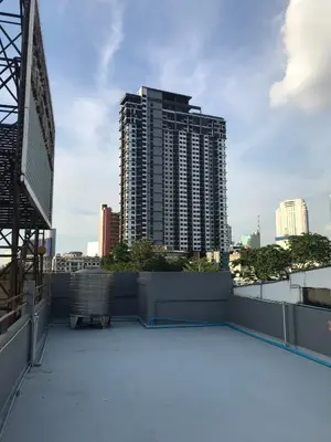 a balcony with a view of a tall building at 168 House 4A4B 350m BTS Krungton Buri near Icon Siam in Godown