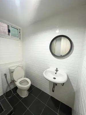 a white bathroom with a toilet and a sink at XX Mitr Inn The Grand Palace - Mrt Samyot Station มิตร อินน์ พระบรมมหาราชวัง in Bangkok