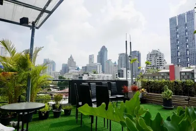 a balcony with a view of a city skyline at Hash Silom Apartment @ Silom Soi 3 in Bangkok