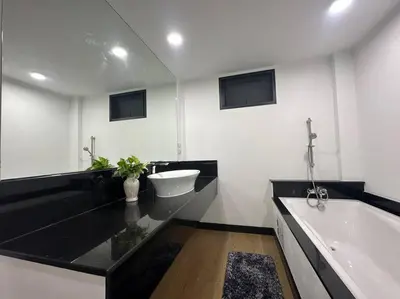 a bathroom with a tub and a sink and a bath tub at Cozy home @ Chatcuchak/中文服务 in Bang O
