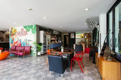 a restaurant with a table and chairs in a room at BB House Mini Suite Hotel in Ban Zong Katiam