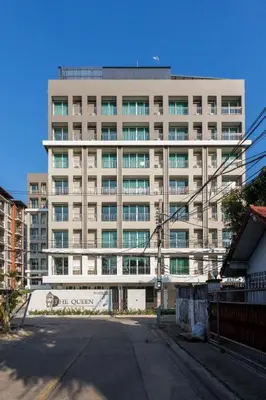 a large building in front of a building at The Queen Palace in Ban Bang Talat