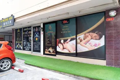 a building with posters on the side of it at SURANG MANSION in Ban Bang Khen (1)