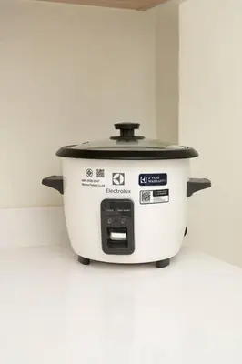 a white slow cooker sitting on a counter at Townhouse in Pratunam Bangkok in Bangkok