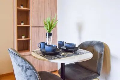 a table with blue cups and saucers on it at BTS Ekkamai-free pool-bus to pattya in Bangkok