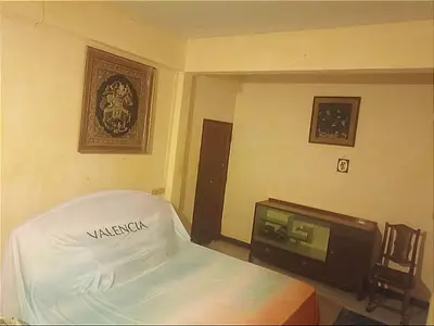 a bedroom with a bed and a tv in it at Best Guest Bangkok in Bangkok