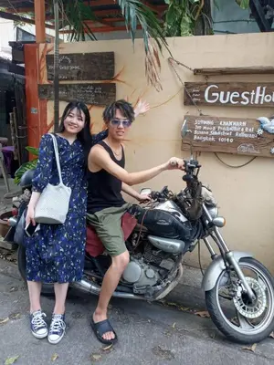 a man and a woman sitting on a motorcycle at GN GOOD NICE in Bangkok
