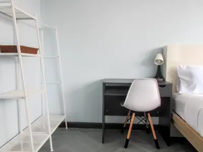 a bedroom with a bed and a desk and a chair at 420 Hostel - Ekkamai Buds & Beds in Bangkok