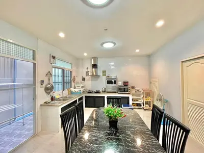a kitchen with a table with chairs and a counter top at S52 Near On nut BTS 300m*7-11 in Phra Khanong