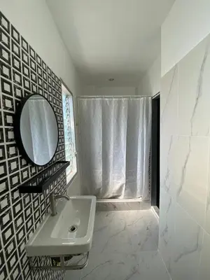 a white bathroom with a sink and a mirror at Bangkok vibe, City House, 7 mins to BTS, City center, Private room in Sathon, Private bathroom, Bangkok, Thailand in Bangkok