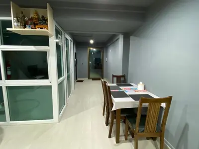 a dining room with a table and chairs at Bangkok vibe, City House, 7 mins to BTS, City center, Private room in Sathon, Private bathroom, Bangkok, Thailand in Bangkok