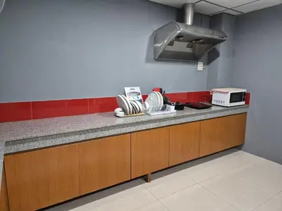 a kitchen with a counter top with a toaster oven at Chiangmai vibe, City House, 7 mins to BTS, City center, Private room in Sathon, Private bathroom, Bangkok, Thailand in Bangkok
