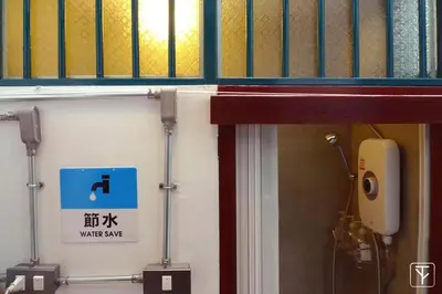 a bathroom with a water safe sign on the wall at T-Boutique Hostel - Hua Lamphong in Bangkok