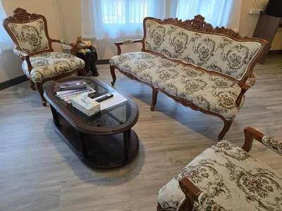 a living room with two chairs and a table at Victory place 2 (Golden Mount) in Bangkok