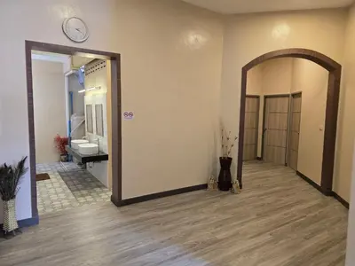 a hallway with a large mirror and a bathroom at Victory place 2 (Golden Mount) in Bangkok