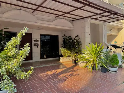a courtyard with plants in a building at Private House 3 Suite Beds + Double Beds in Heart of Phromphong in Bangkok