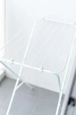 a white metal bench in a room with a window at 2BR, 6 Mins walk BTS Wuttakat in Bangkok