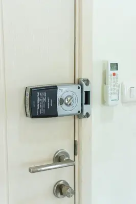a door with a cell phone sticking out of it at 2BR, 6 Mins walk BTS Wuttakat in Bangkok