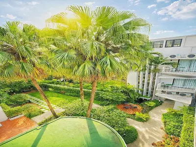 an aerial view of a garden with palm trees at Townhouse PK Garden in Bangkok
