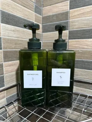 two bottles of soap sitting next to each other at Thai Siwilai Hostel in Bangkok