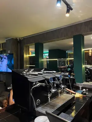 a kitchen with a sewing machine on a counter at Thai Siwilai Hostel in Bangkok