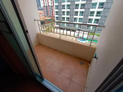 an empty balcony with a view of a building at jw place รามคำแหง 40 in Bangkok