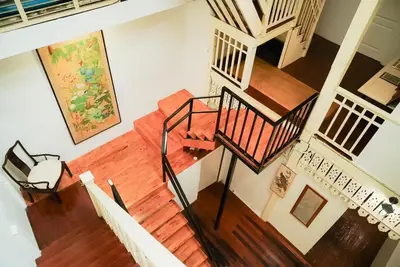 an overhead view of a staircase in a house at XX Mitr Inn Yaowarat - มิตร อินน์ เยาวราช in Khlong San