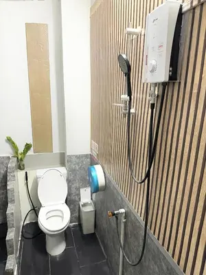 a bathroom with a shower with a toilet in it at Bed Space Hostel Khaosan in Bangkok