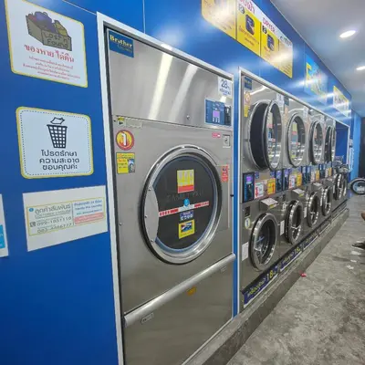 a row of washing machines in a store at 211 Spacious studio with breezy fan full amenities with free Wi-Fi in Bangkok