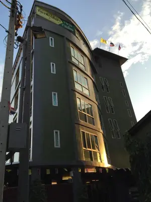 a large building with two flags on top of it at The State Apartment in Bangkok