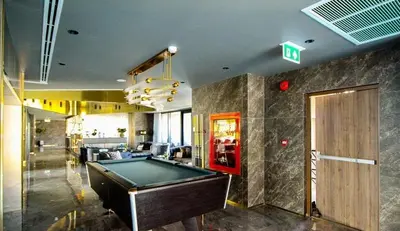 a billiard room with a pool table in a building at Modern condo nr BTS ONNUT WIFI in Bangkok
