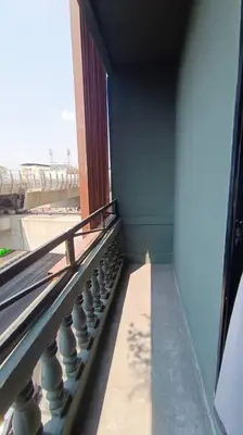 a view of a balcony of a building at Chubby 9 Standard room in Ban Bang Phlat