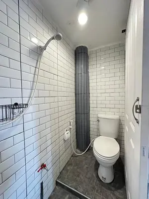 a bathroom with a toilet and a shower at Chubby 9 Standard room in Ban Bang Phlat